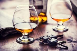 alcohol and car keys on table