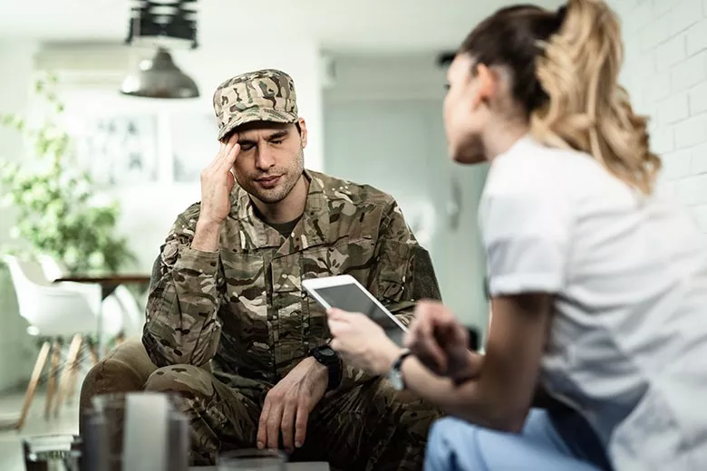 military-veteran-headache-with-doctor