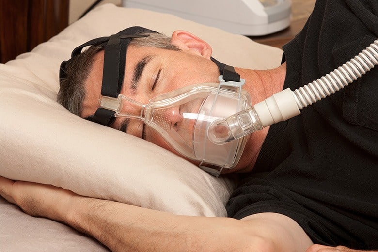 man-sleeping-wearing-cpap-machine-veteran-sleep-apnea