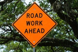 road-work-ahead-orange-road-traffic-sign