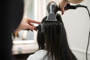 female-hair-salon-blow-drying-hair-relaxer-lawsuit